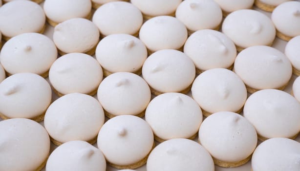 Background of sugar cookies in white glaze, close-up view, shot from above.