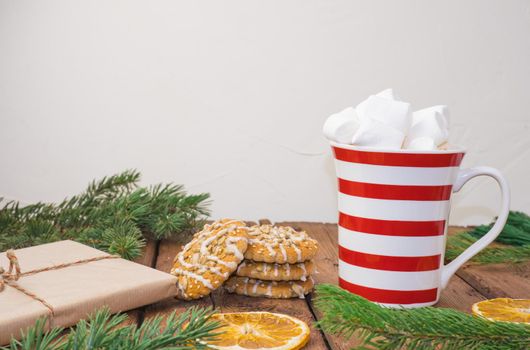 sweet hot cocoa with marshmallows, winter christmas drink on wooden background