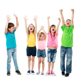 joyful laughing children with hands up in colorful clothes isolated on white background