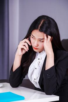 woman in business suit working in stress desperate talking on a mobile phone 