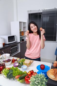 young woman with egg in kitchen room