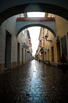 Kosice, Slovakia - July 09, 2015: wet empty Kosice street with arches after rain