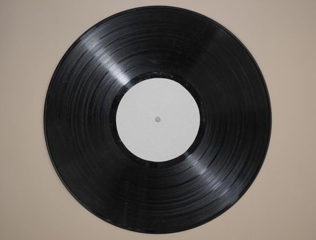 vinyl record on beige background.