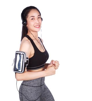 fitness woman running and listening to music on a white background