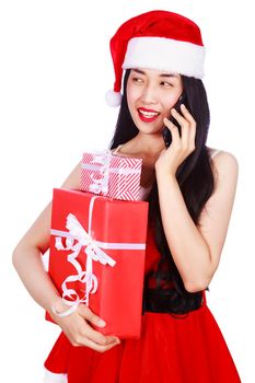 woman in Santa Claus clothes calling on mobile phone with gift box isolated on a white background