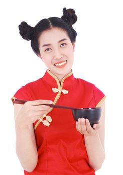 happy woman wearing chinese cheongsam dress with chopsticks and bowl isolated on a white background