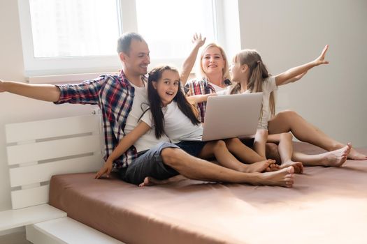 Animated family buying online lying down on bed at home