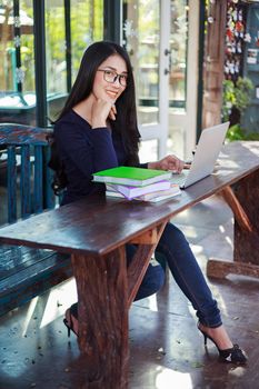 beautiful woman working with laptop in the cafe