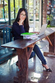 beautiful woman working with laptop in the cafe