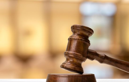 Law and justice concept image. Brown wooden background