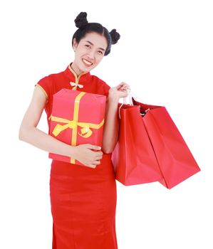 happy woman holding shopping bag and red gift box in concept chinese new year celebration isolated on a white background