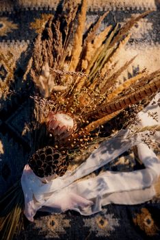 elegant wedding bouquet of dried wildflowers and plants