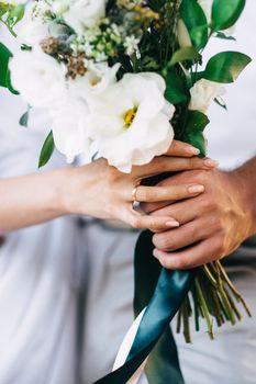 elegant wedding bouquet of fresh natural flowers and greenery