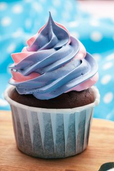 Side view of yummy cupcakes with assorted flavor. Shot on the table