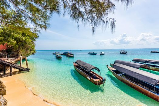 beautiful colorful landscape with boats near african coast and colorful ocean and sky