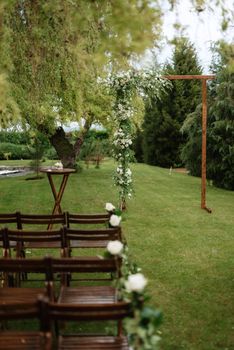 wedding ceremony area with dried flowers in a meadow in a green forest