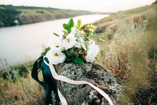 elegant wedding bouquet of fresh natural flowers and greenery