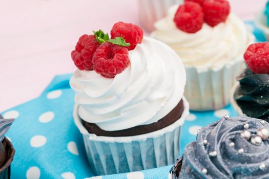 Cupcakes decorated with sprinkles and frosting - close up