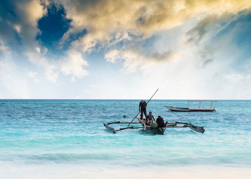 beautiful colorful seascape with fishing boats and fishermen, Zanzibar