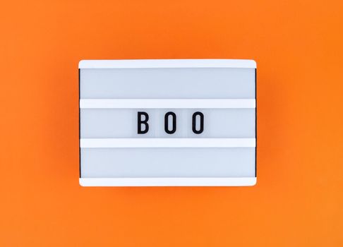 Light box with Boo word on orange background.