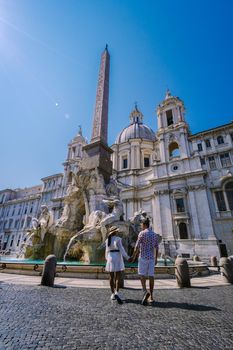 Piazza Navona in Rome, Italy Europe in the morning, a couple on city trip Rome. Asian woman and European man in Rome vacation city trip