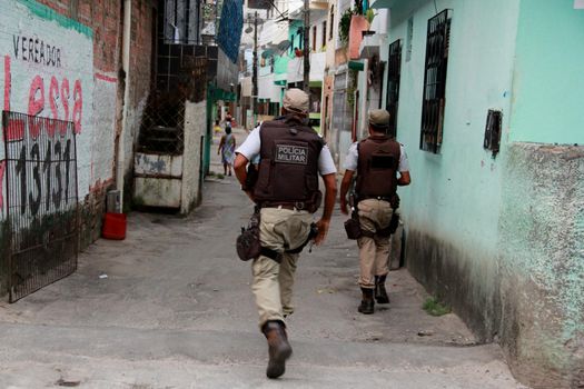 salvador, bahia, brazil - noovember 21, 2012: Military Police agents are seen during police operation in the Pernambues neighborhood in the city of Salvador.