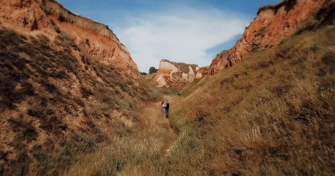 deep clay canyon overgrown with green grass