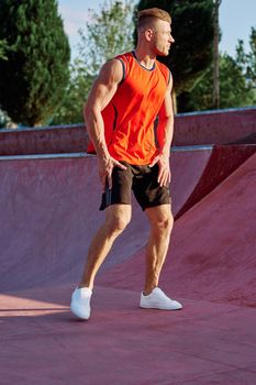 sports man on the playground in the park workout. High quality photo