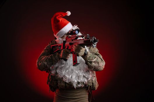 the man in a military uniform with a gun and a Santa Claus hat