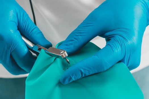 Dental procedure, installation of a cofferdam to the patient, modern treatment, preparation for installation.2020