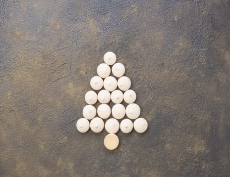 Christmas tree made from cookies on a black background. Christmas baking concept