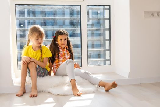 Creative cute girls, two sisters at home