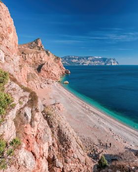 Beautiful Vasili beach in Balaklava, Sevastopol, Crimea. View from the top of the rock. azure sea, sunny day clear sky background. Copy space. The concept of calmness, silence and unity with nature.