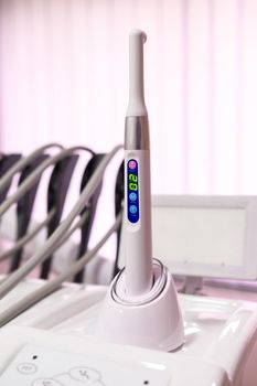 Ultraviolet caries detector on a stand, modern dental equipment. new