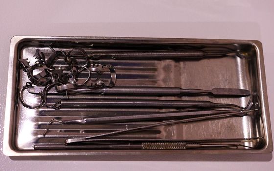 Set of sterile dental instruments close up. new