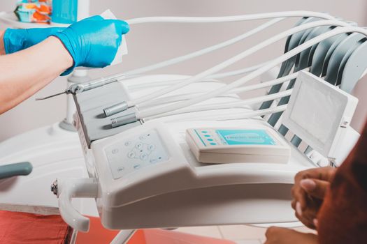 Cleaning the workplace after treatment of the patient. Dental tools close up, dentist tools on a medical table.2020