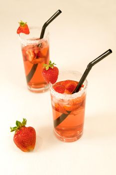 closeup of fresh strawberry water fruit and juice isolated in white background. Mexican Strawberry Water - Agua de Fresa- sunny weather and sunlight