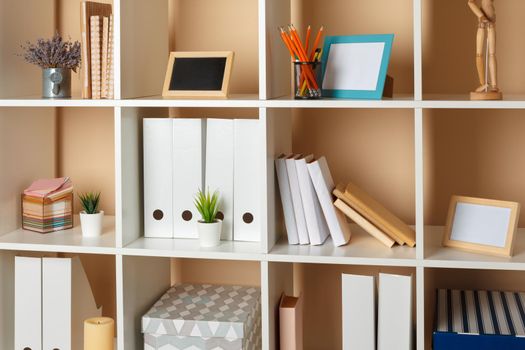 Home office working space. white shelf with accessories