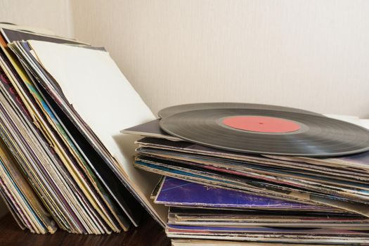 a bunch of old vinyl records. Retro music recording.