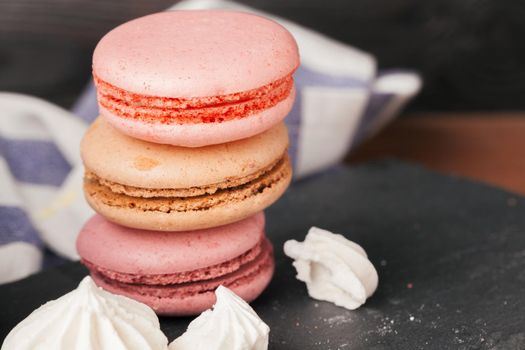 Close up colorful macarons dessert with vintage pastel tones