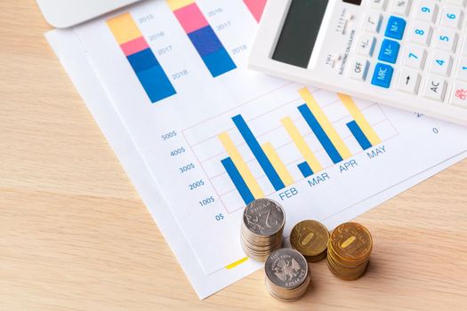 Saving stack coins money concept. Graph, chart document close up
