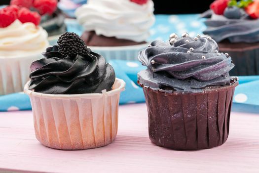 Cupcakes decorated with sprinkles and frosting - close up