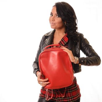 young woman holding red backpack in black leather jacket white background