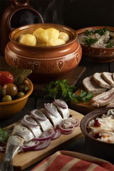 Festive table in the Russian village. Table set for dinner with traditional snacks and dishs of Russian cuisine.