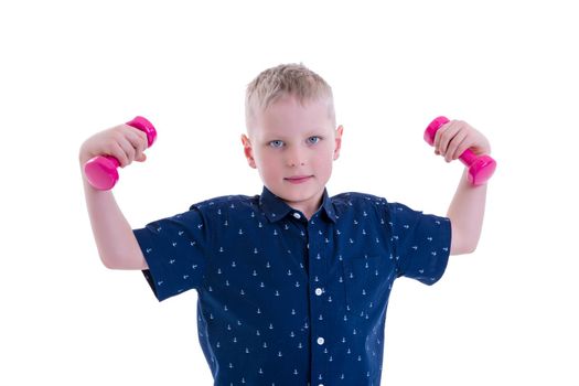 The little boy is engaged in fitness, he lifts dumbbells in the gym. The concept of a happy childhood, the development of children's sports. Isolated on white background.