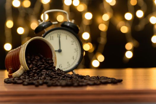 Coffee beans Placed on the desk Orange bokeh floor scene