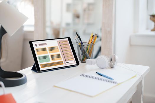 E-learning on digital tablet on white wooden table, close up