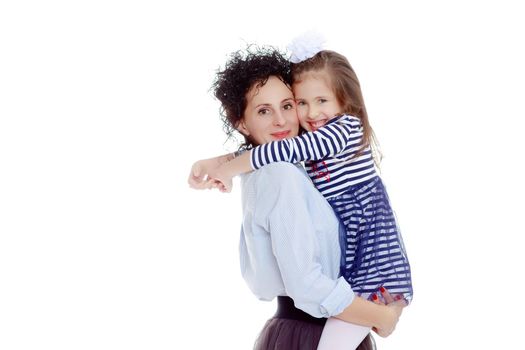 Happy young beautiful mother,lifted his little beloved daughter .And the girl embraced her mother's neck and pressed my face to her cheek.Isolated on white background.