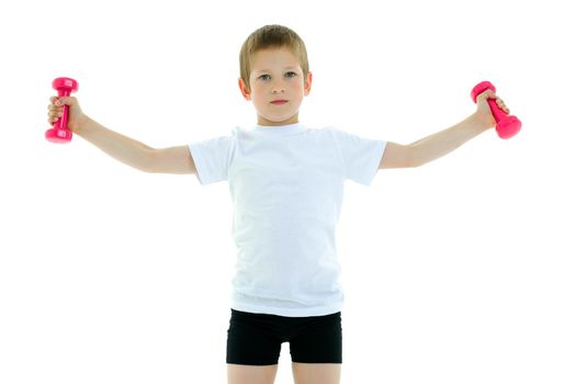 The little boy is engaged in fitness, he lifts dumbbells in the gym. The concept of a happy childhood, the development of children's sports. Isolated on white background.