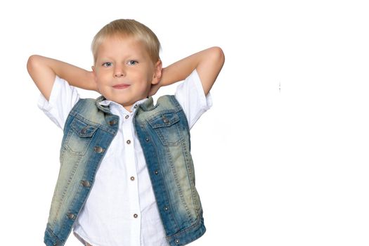 Little boy emotionally waving his hands in the studio on a white background. The concept of a happy childhood, family and people. Isolated.